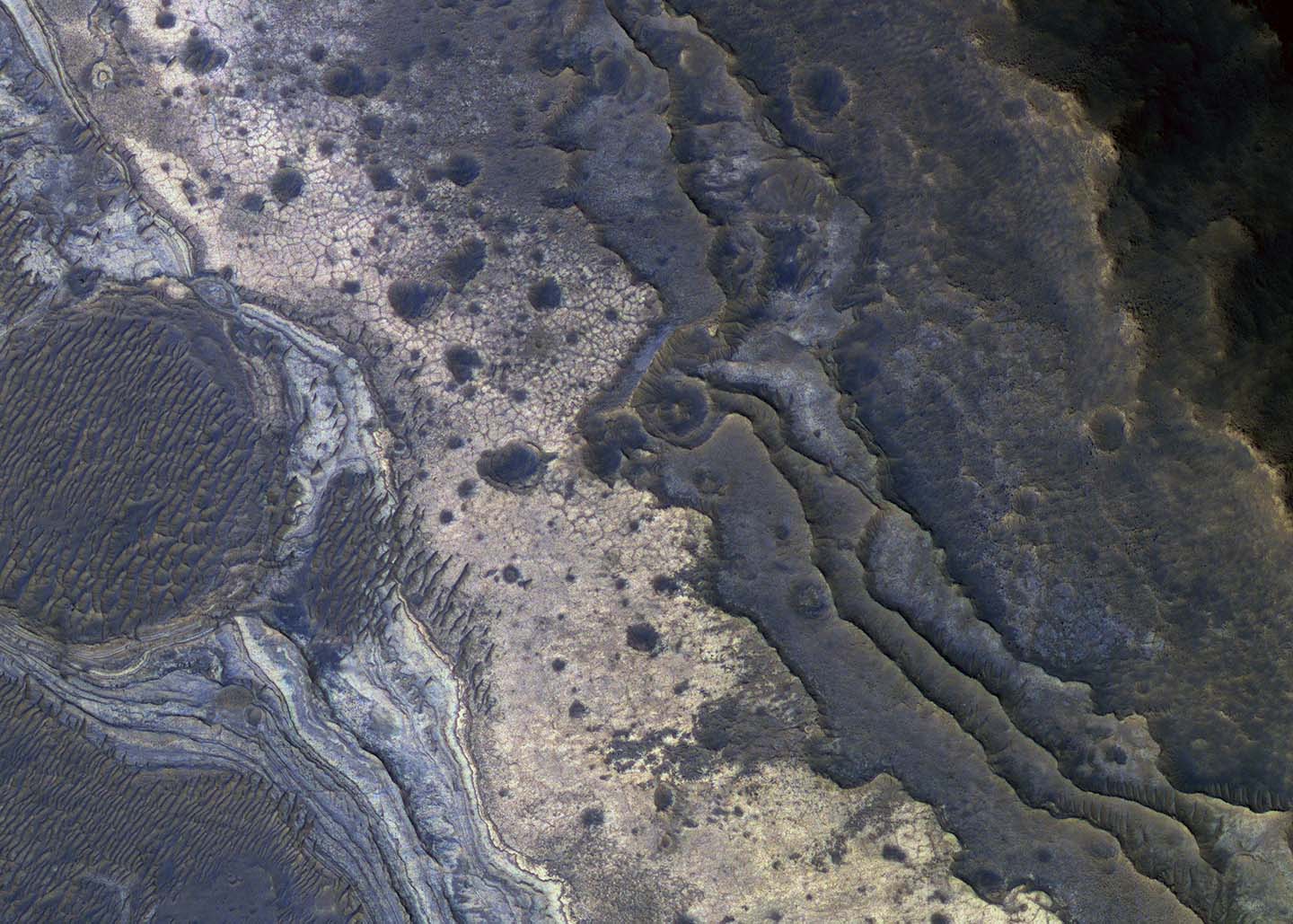NASA's Mars Reconnaissance Orbiter has revealed Martian rocks containing a hydrated mineral similar to opal