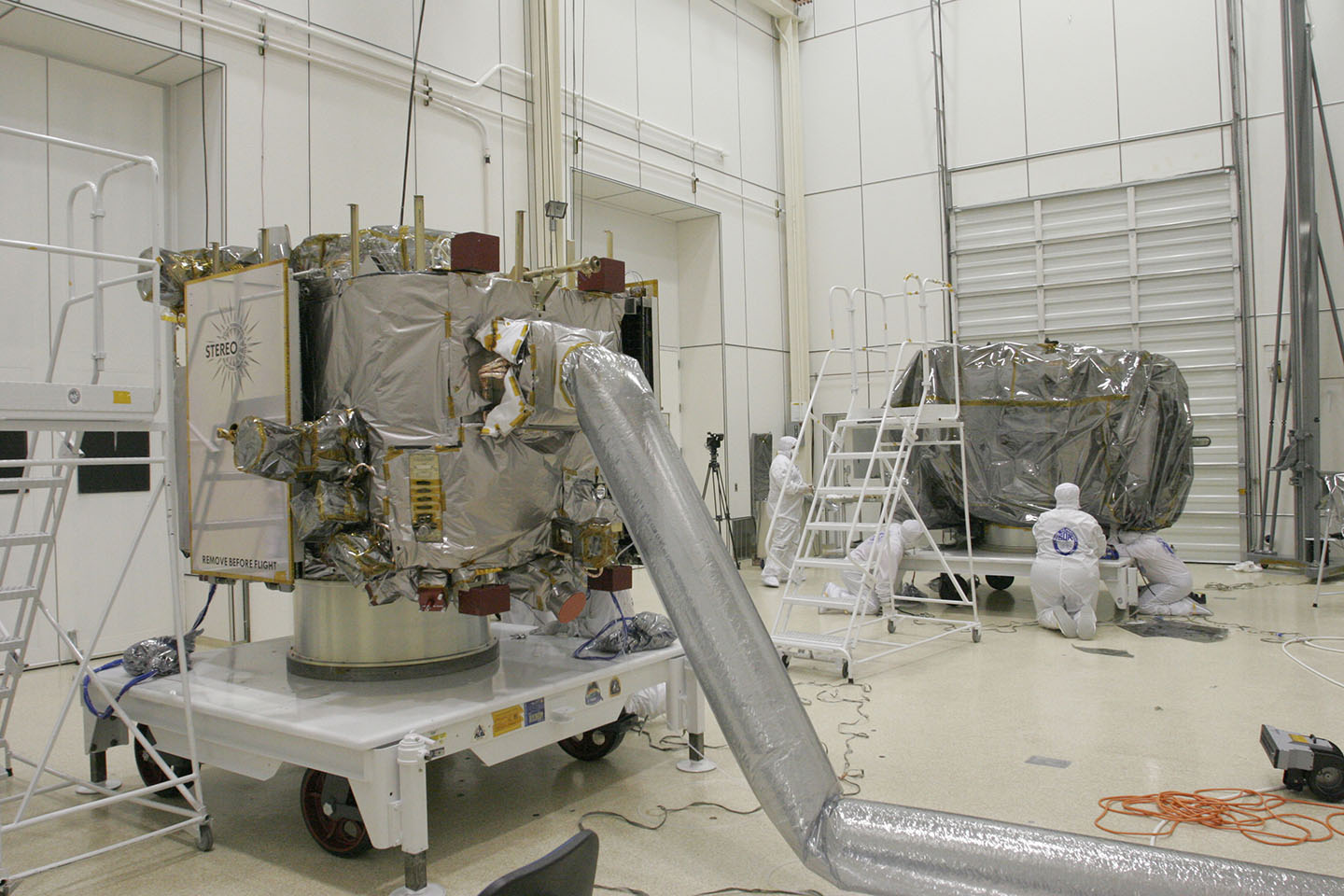 STEREO technicians prepare the twin STEREO observatories for transport