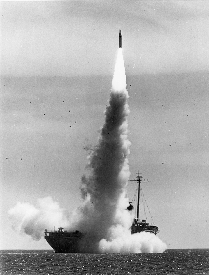 A Polaris prototype streaks skyward from a launcher aboard USS Observation Island off Cape Canaveral (1959)