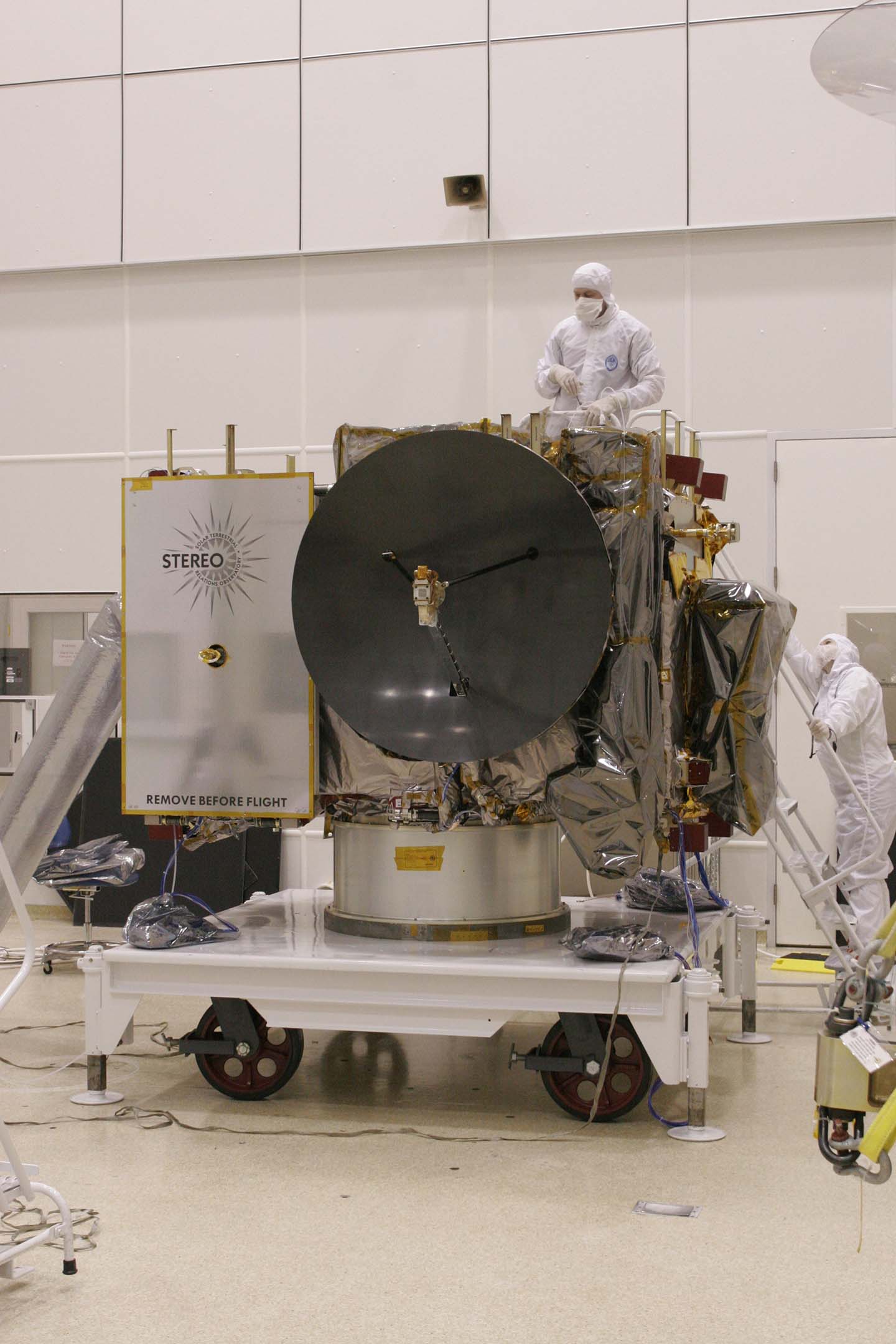 STEREO technicians prepare one of the twin STEREO spacecraft for transport