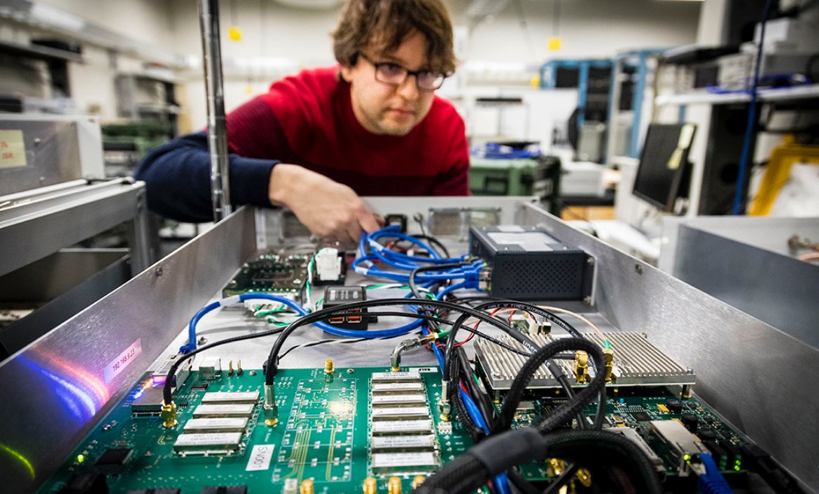 A JHU EP program student studies some computer hardware