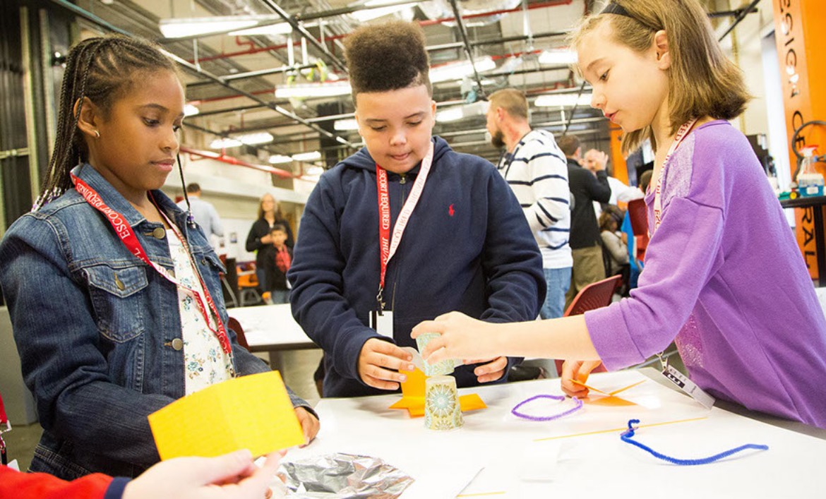 Children working on a craft project in an APL lab during Family Day