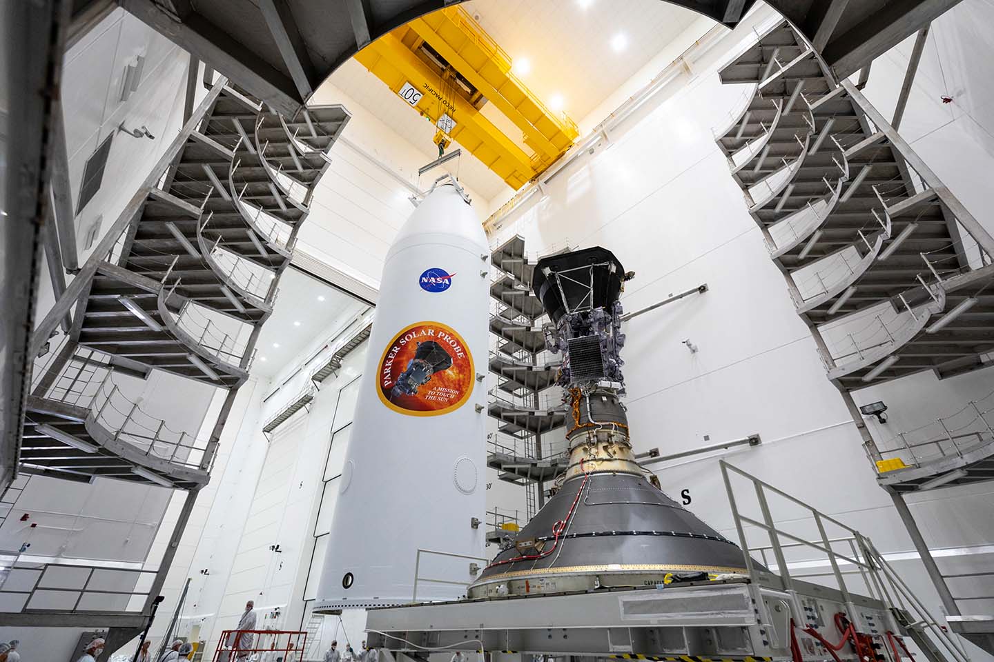 Parker Solar Probe, shown on July 16, 2018, is mounted atop its third stage rocket motor with one half of the 62.7-foot tall fairing that will encapsulate it