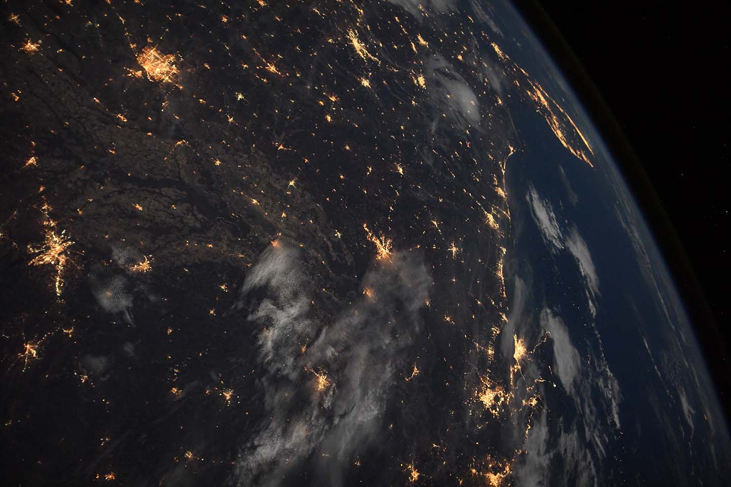 View of southern U.S. states and cities at night, taken from the International Space Station.