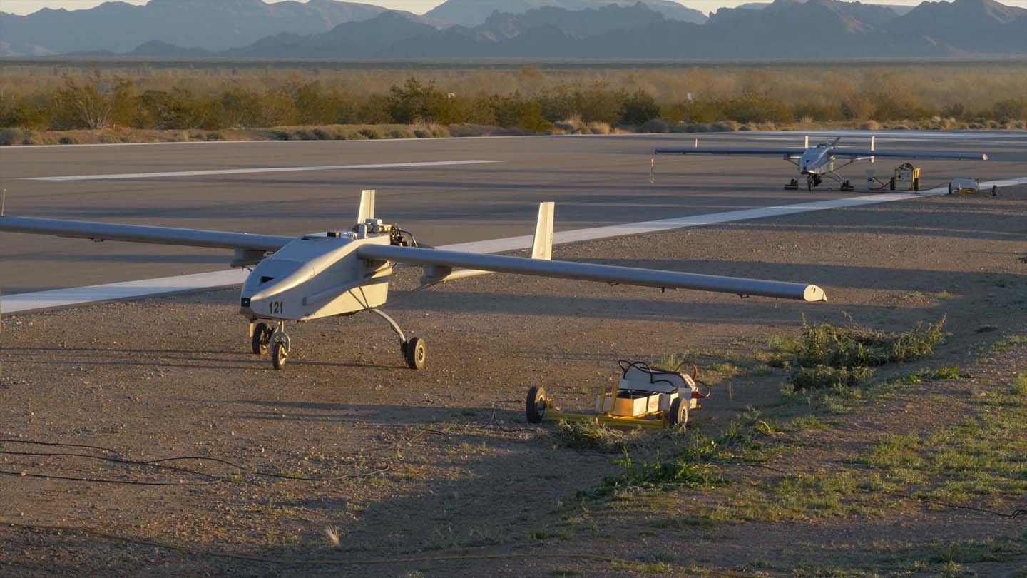 Q-23 Tigersharks line up on a runway at Yuma Proving Ground for the CODE demonstration.