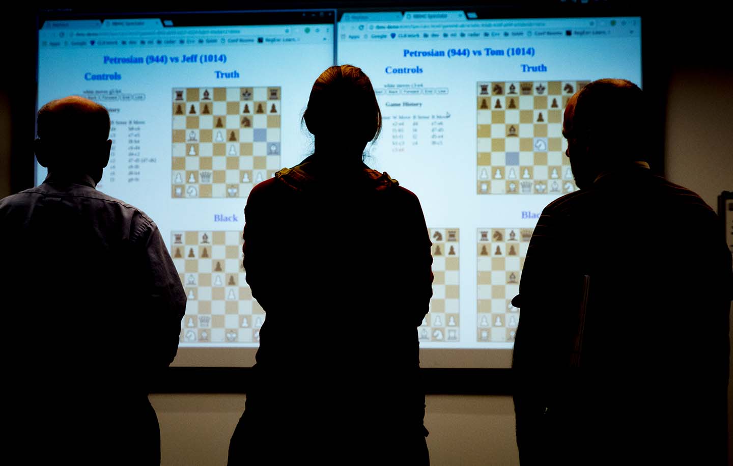 Participants in an internal Reconnaissance Chess Challenge at APL observe a player’s moves