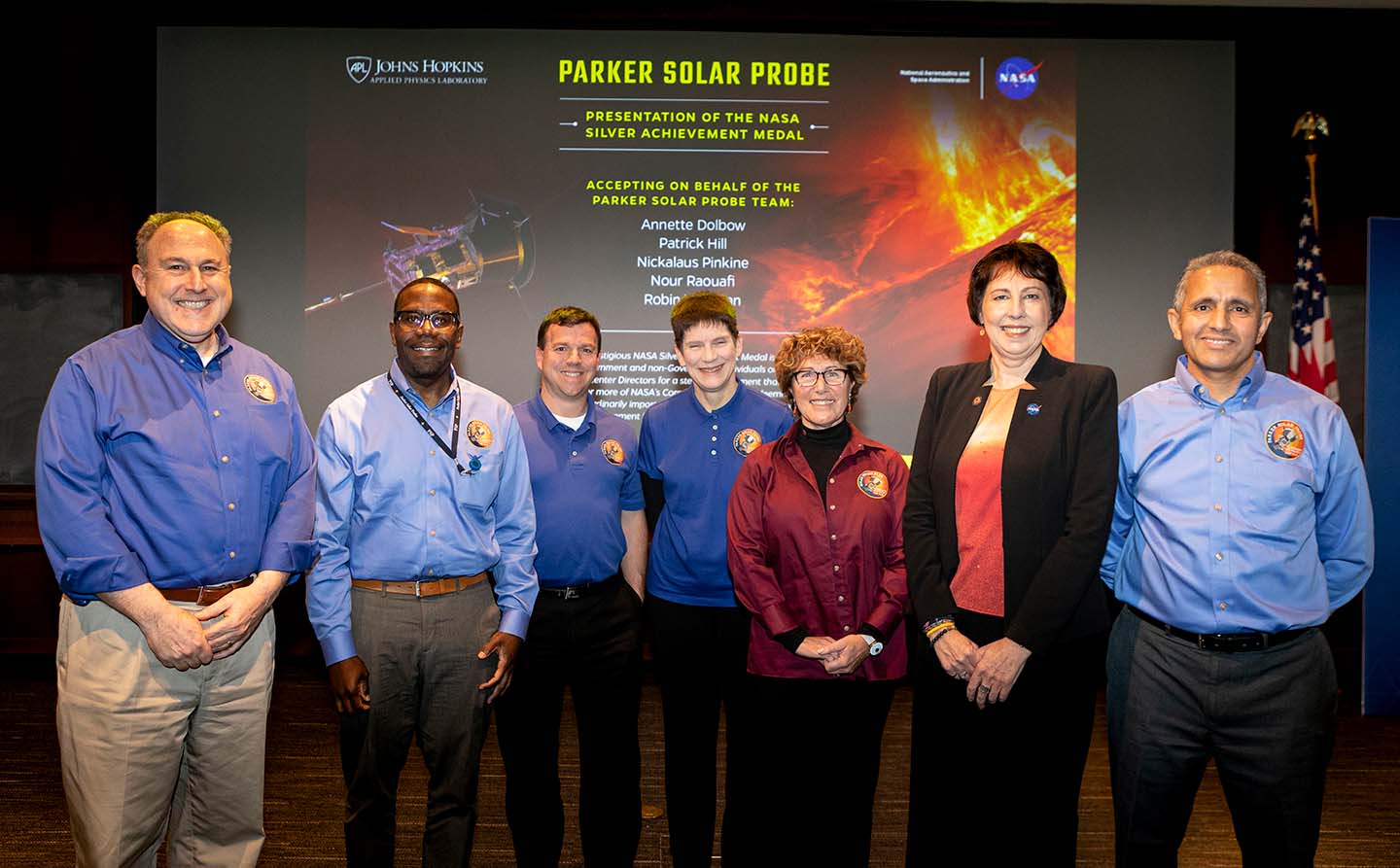 Pictured left to right: Andy Driesman, APL, previous project manager; Patrick Hill, APL, current project manager; Nickalaus Pinkine, APL, mission operations manager; Robin Vaughn, APL, spacecraft system engineer; Annette Dolbow, APL, integration and testing lead engineer; Nicky Fox, NASA Heliophysics Division director; and Nour Raouafi, APL, project scientist