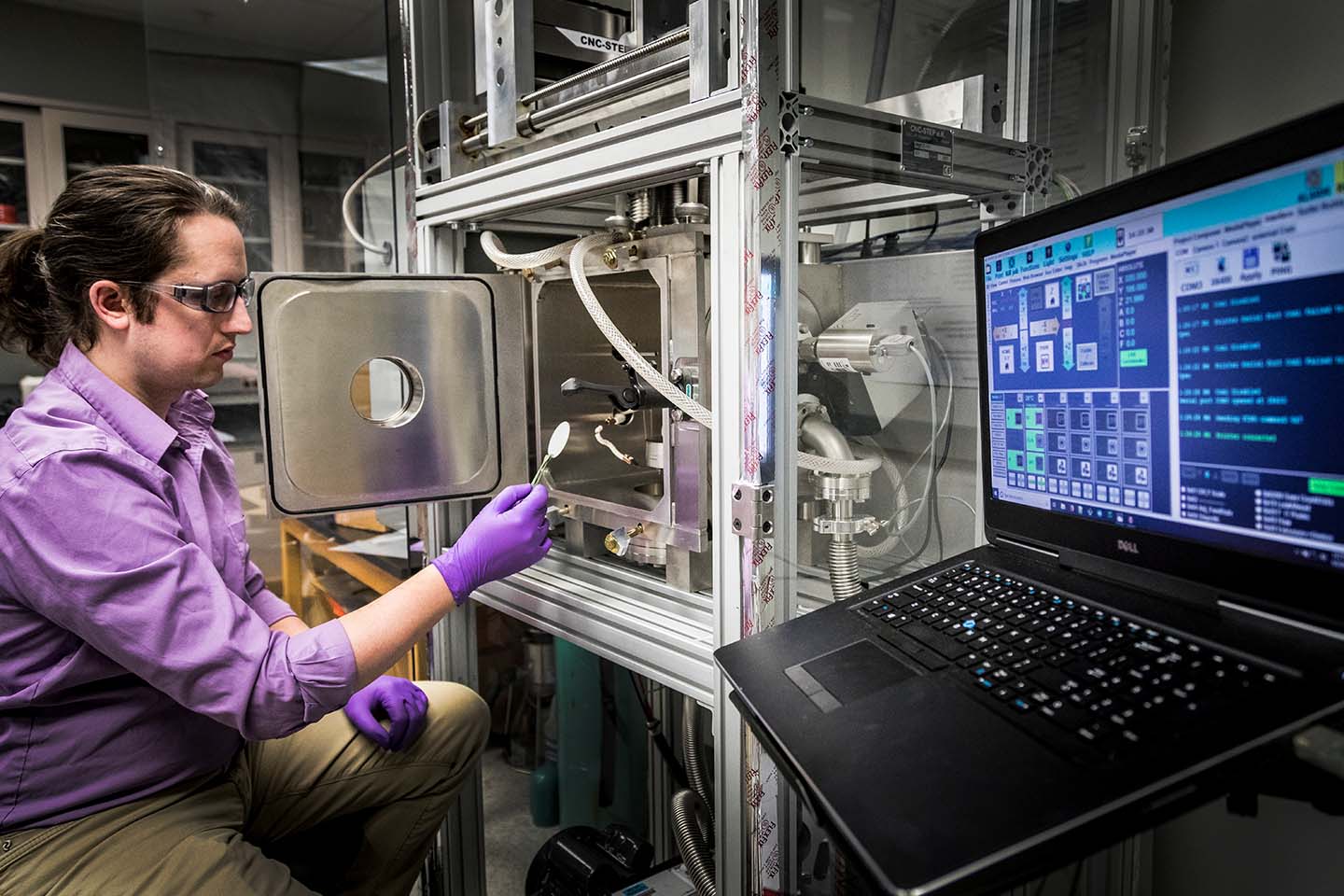 Jarod Gagnon studies a sapphire wafer