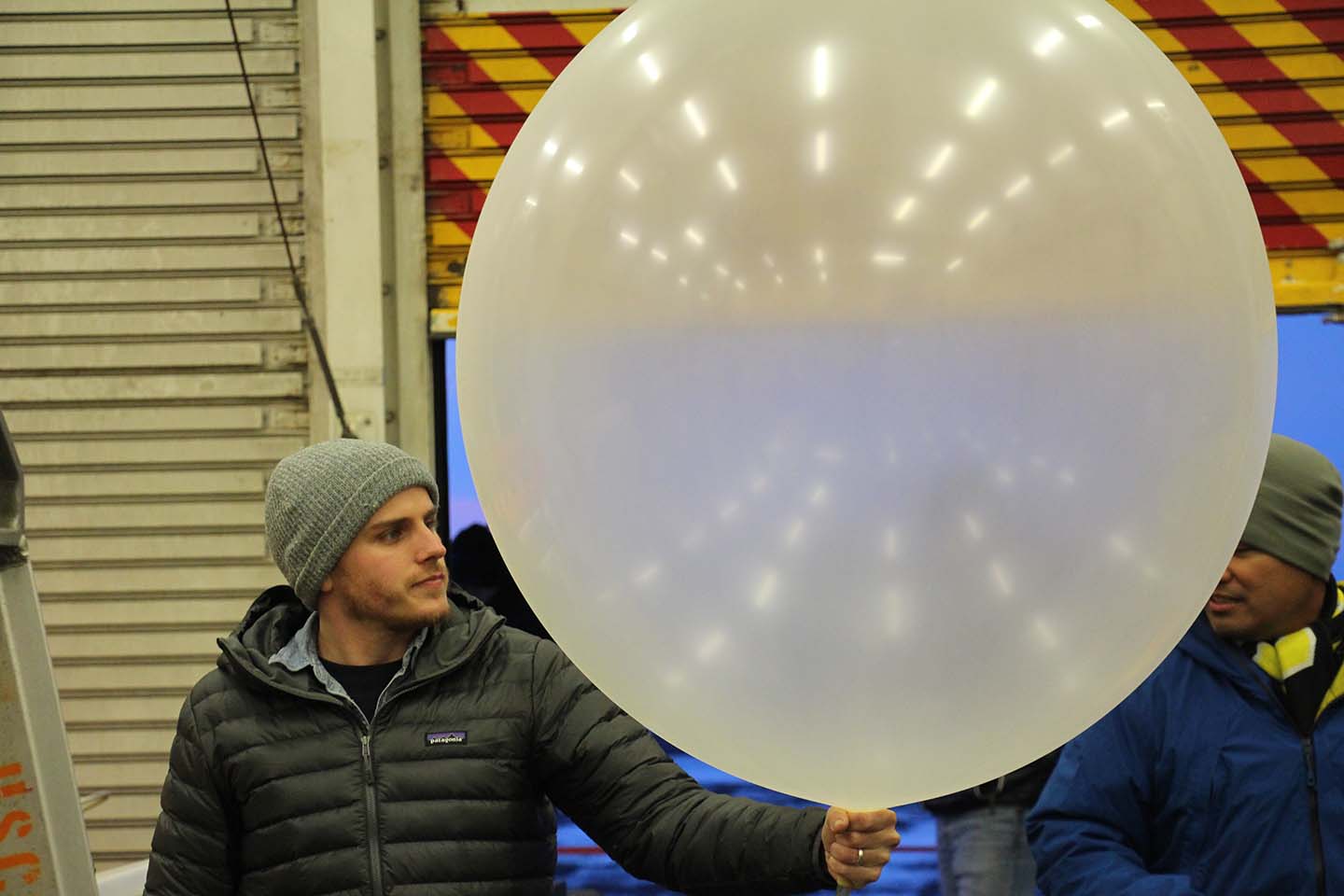 Burchfield prepares to launch a weather balloon.