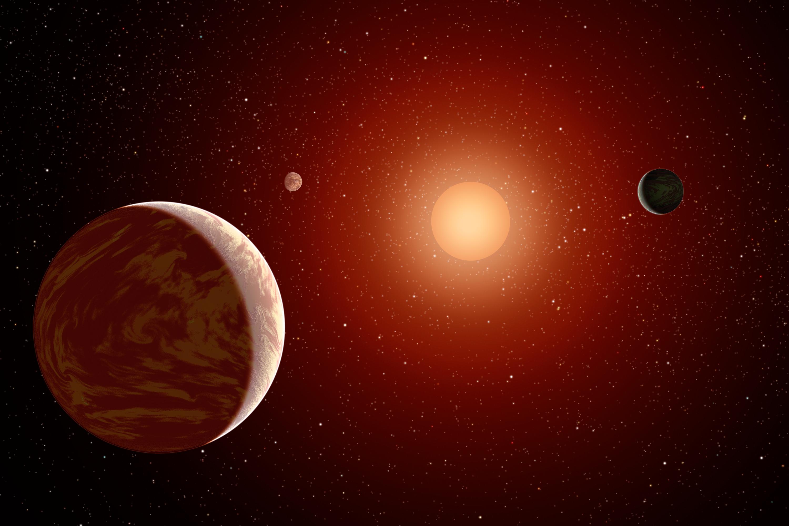 An artist’s conception of a red dwarf star with three orbiting planets.
