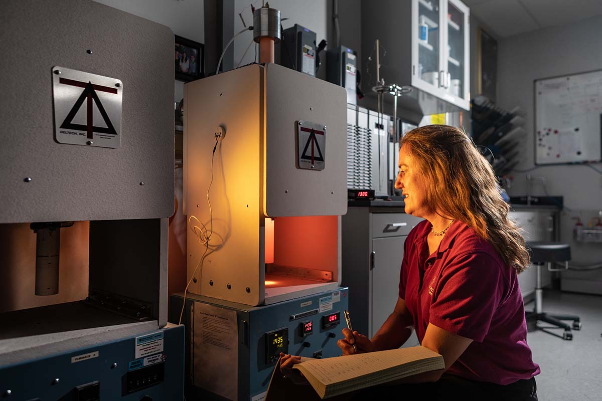 APL planetary scientist Nancy Chabot at a furnace in APL’s Meteorite Laboratory.