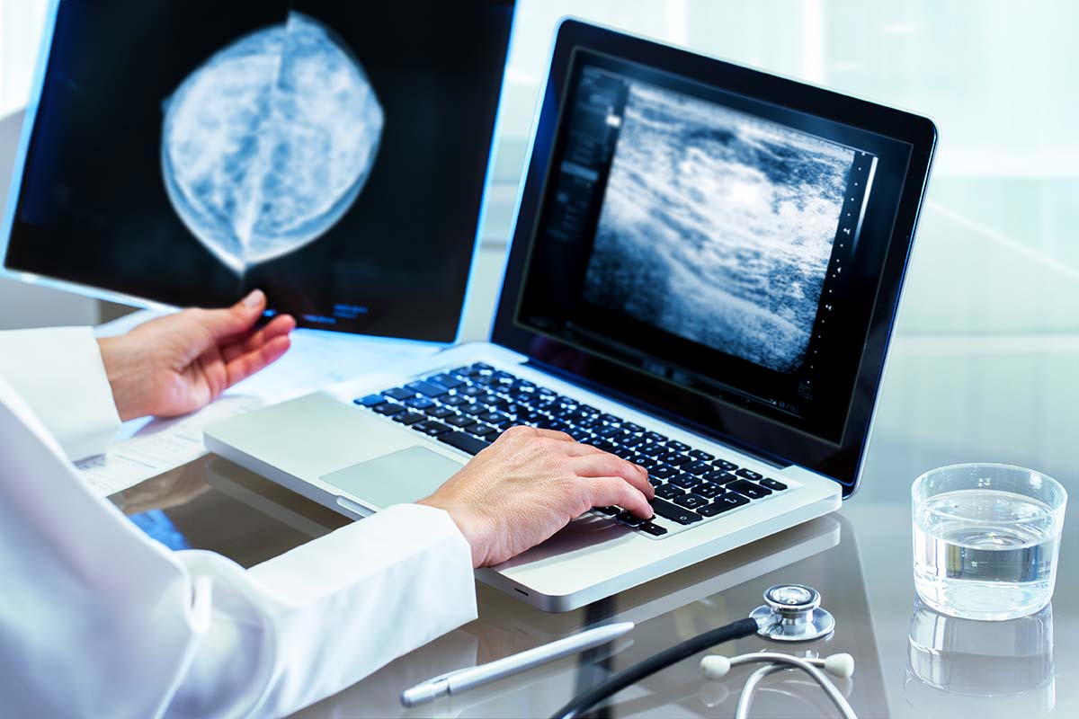 Doctor looks at a computer screen