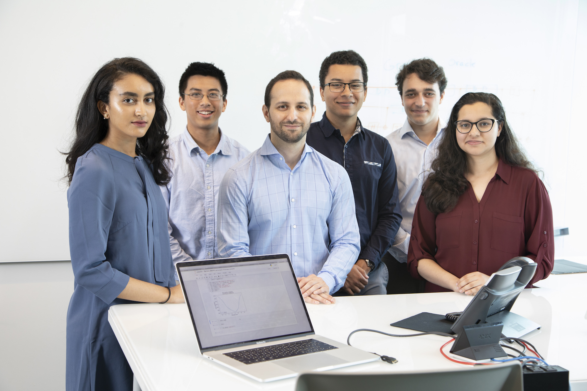 Greg Quiroz (third from left) with interns Reem Larabi, Joseph Boen, Devon Williams, Jake Klein and Lina Tewala.