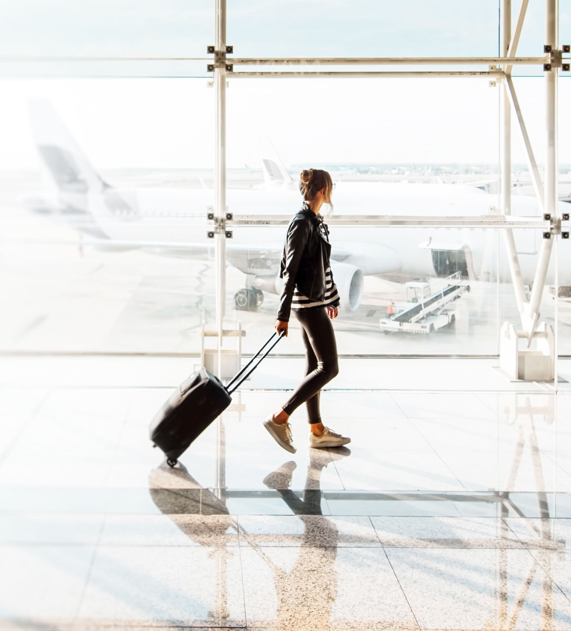 Traveler walks through airport