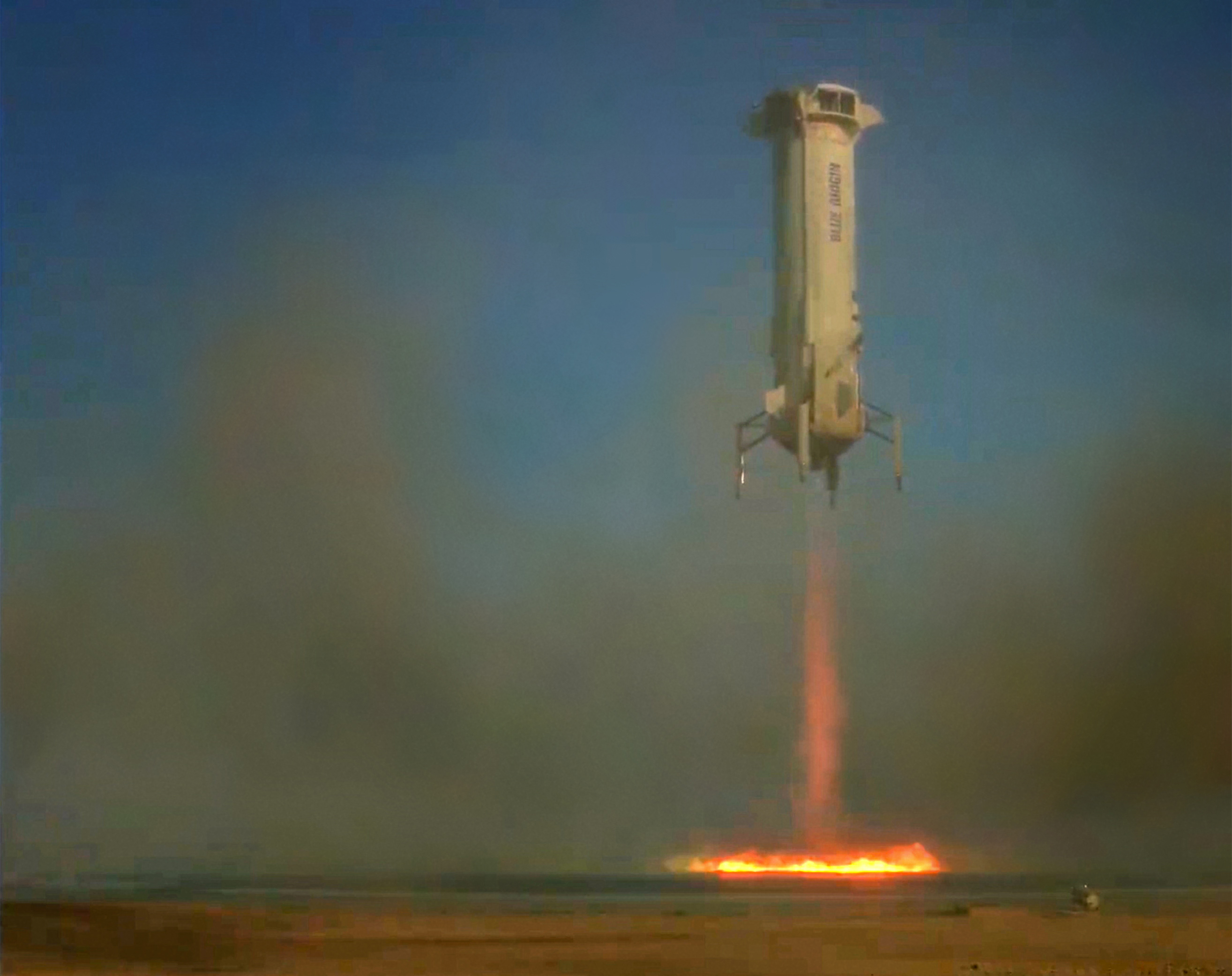 Blue Origin’s New Shepard rocket lands on its pad in West Texas after a successful flight on Oct. 13 that included two Johns Hopkins APL space instruments.  Credit: Blue Origin