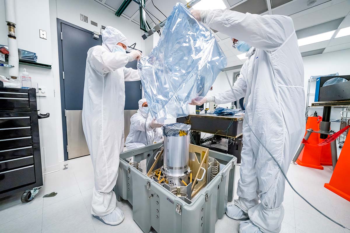 Members of the Lucy LORRI team at APL carefully pack and secure the instrument