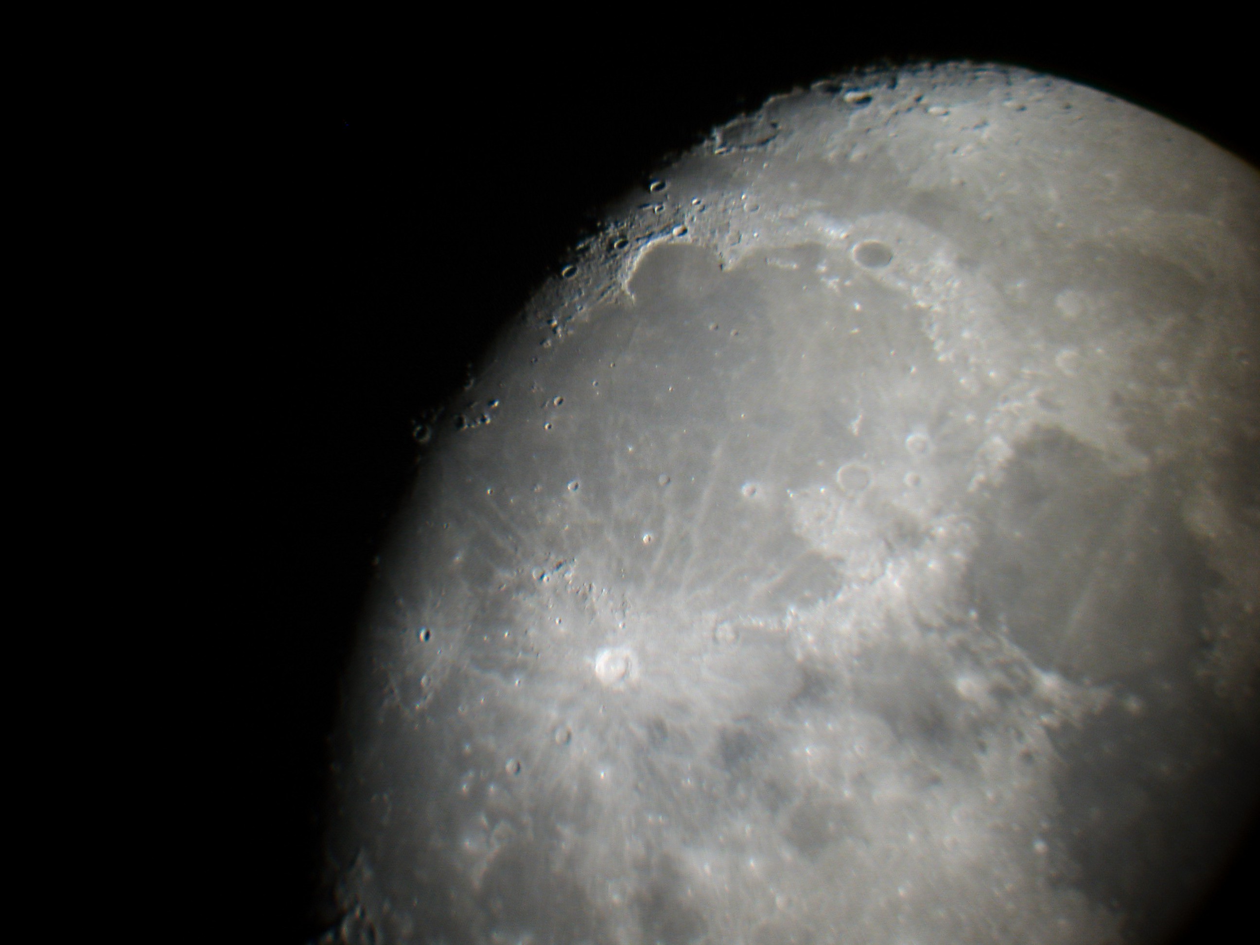 APL intern Jordan Bretzfelder used data from several instruments to discover rocks within the Moon’s Imbrium Basin — the largest of the dark areas visible from Earth, pictured here — that are consistent with the minerals believed to make up the lunar mantle.  Credit: "Mare Imbrium" by Stephan Brunker is licensed under CC BY-SA 3.0