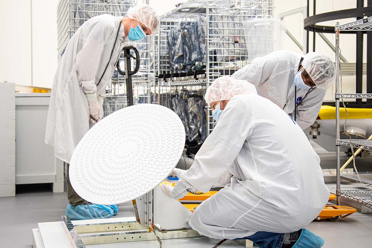 DART team members (from left) John Schellhase, Emory Toomey and Lloyd Ellis of APL inspect the radial line slot array (RLSA) antenna before installing it on the spacecraft