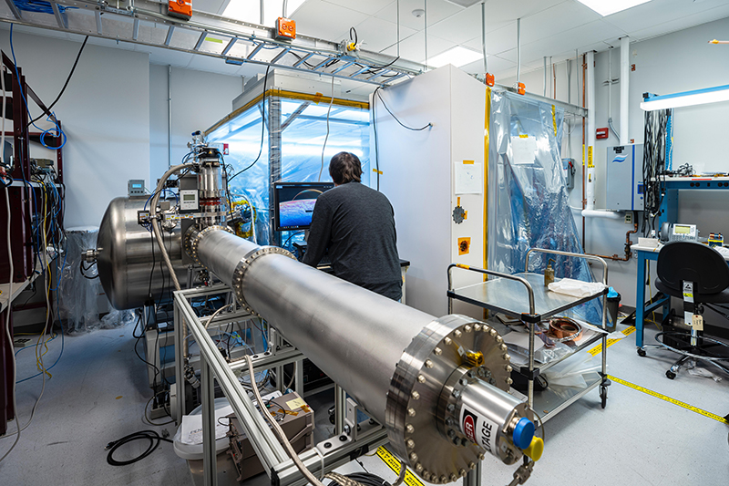 Plasma Instrument for Magnetic Sounding (PIMS) lead engineer David Coren works with APL’s Plasma Instrument Calibration Chamber, recreating the plasma environments that PIMS will encounter in space