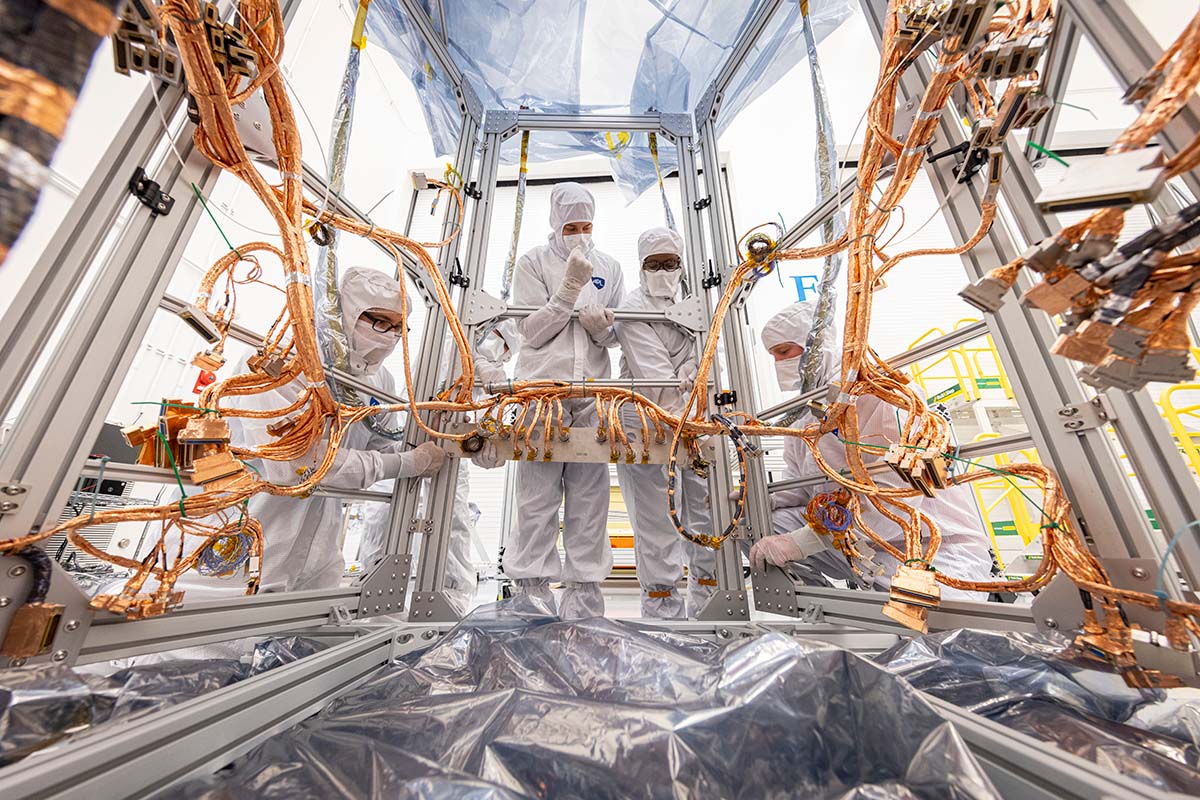 In the same clean room at Johns Hopkins APL, the bake-out fixture is modified in preparation for the transfer and installation of the harness onto Europa Clipper’s propulsion module structure.
