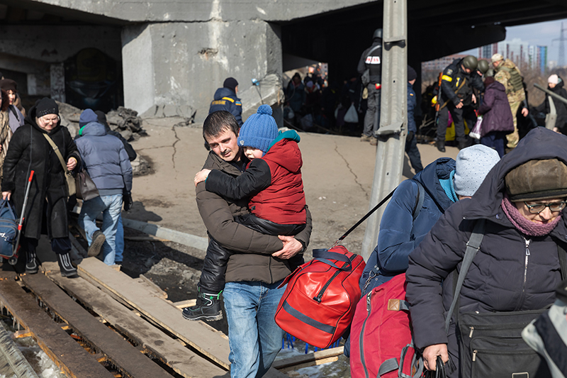 Residents of Irpin, Ukraine, evacuate the city amid Russian attack in March 2022