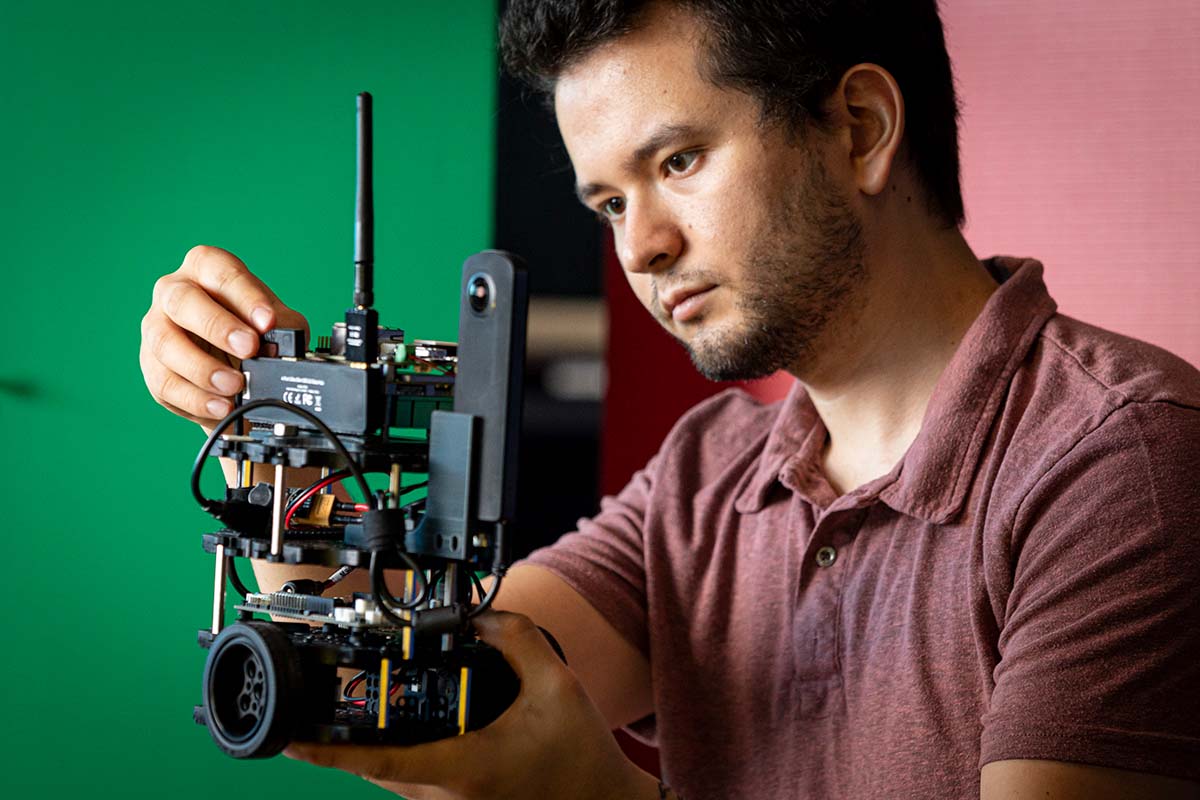 An APL engineer modifies a robot to test its navigation algorithms