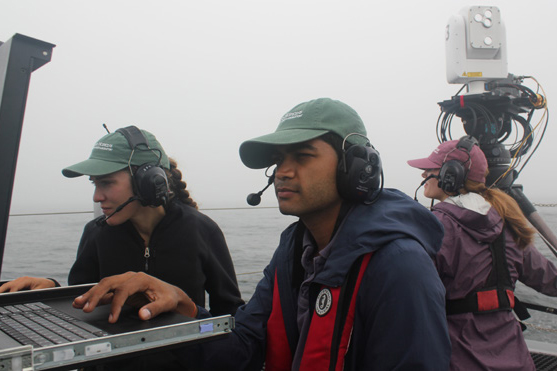 APL FSO operators check the monitors on Sea Hunter as a third operator monitors operations.