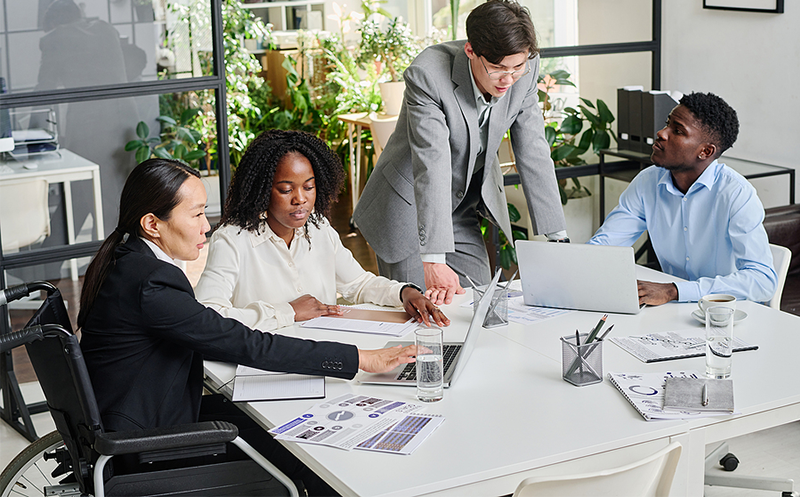 Four people discussing work