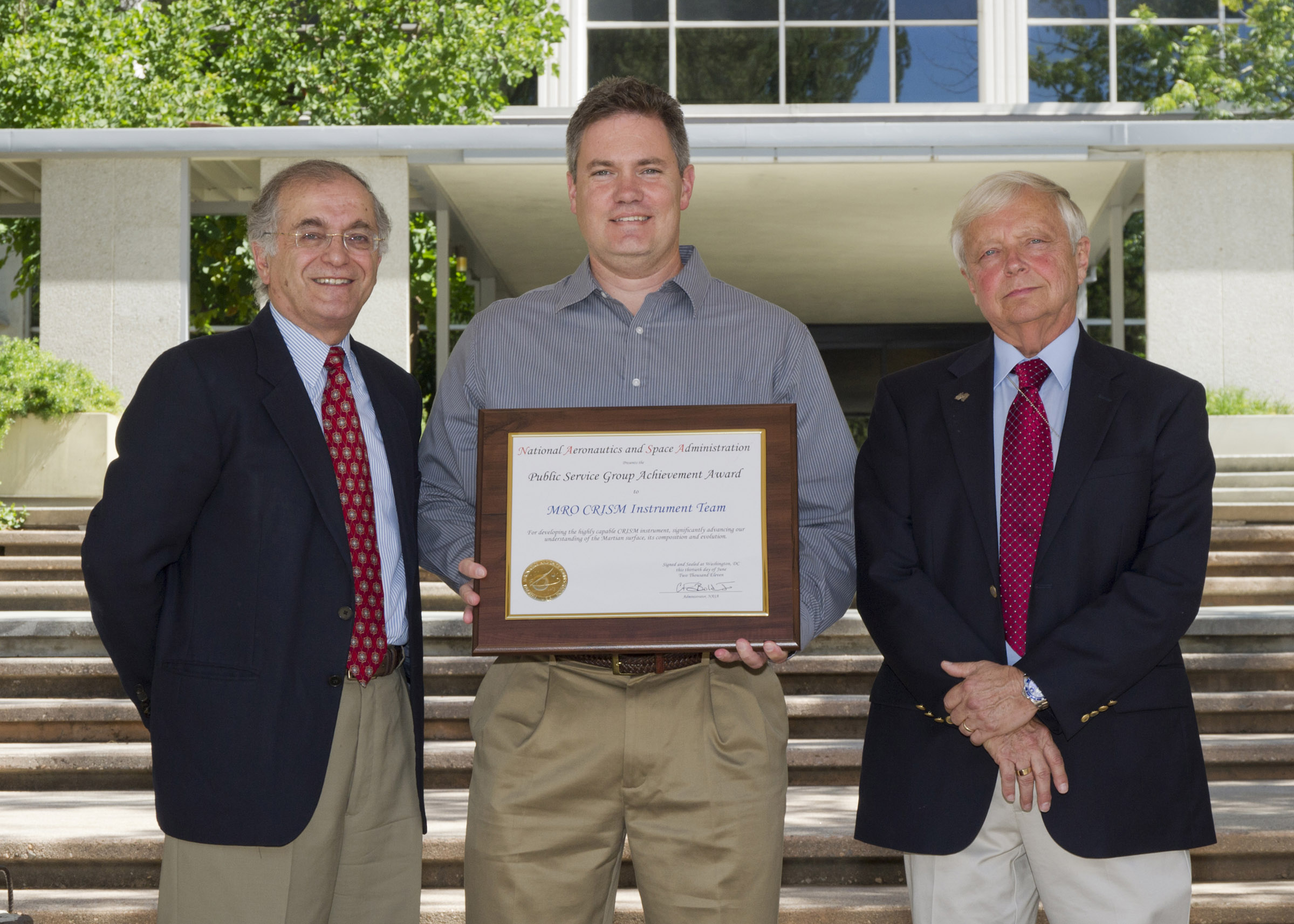 APL's Andy McGovern (center) accepts the NASA Public Service Group Achievement Award for CRISM's instrument team