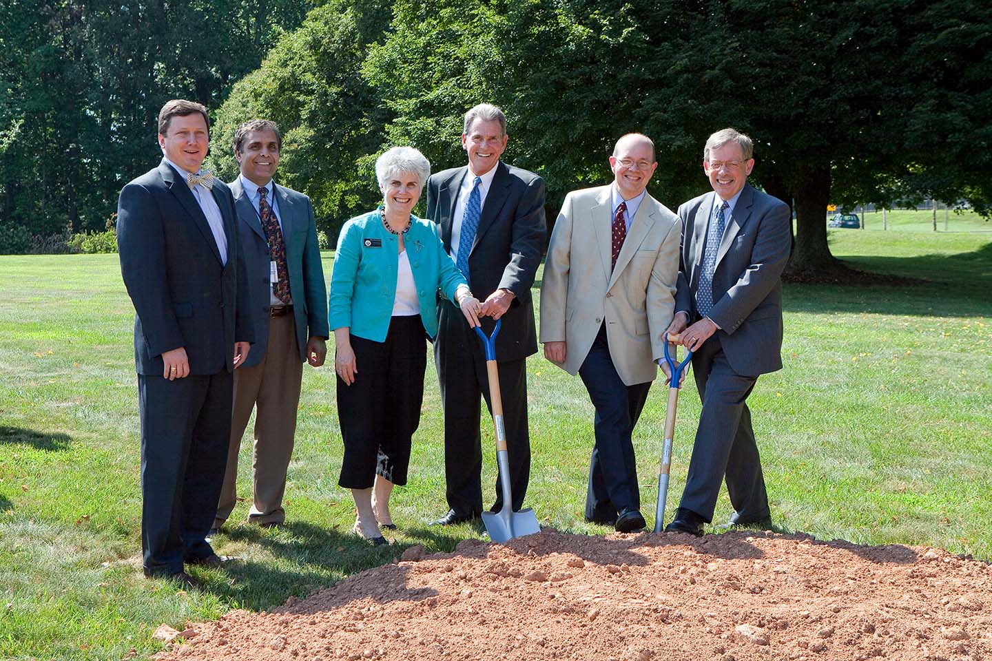 William McBeath of Morgan Gick McBeath Associates; APL Technical Services Department Head Mohammad Dehghani; Howard County Councilwoman Mary Kay Sigaty; Michael Harvey of Harvey-Cleary Builders; APL Space Department Head John Sommerer, and APL Director Richard Roca
