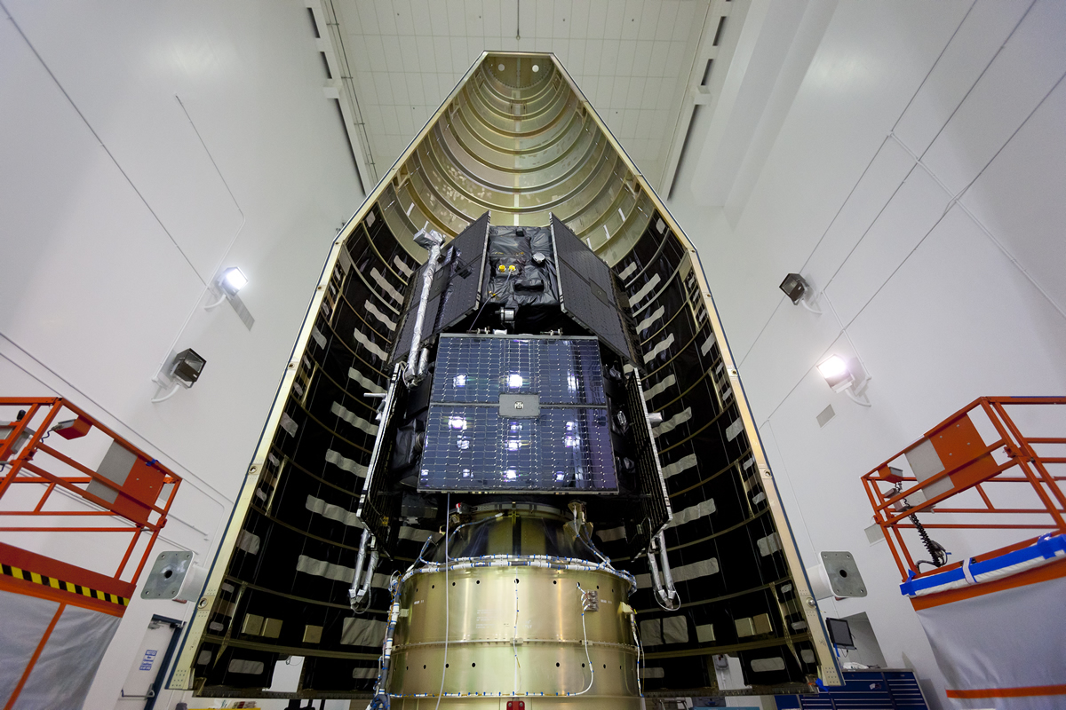 The twin Radiation Belt Storm Probes spacecraft, stacked and in half of their fairing