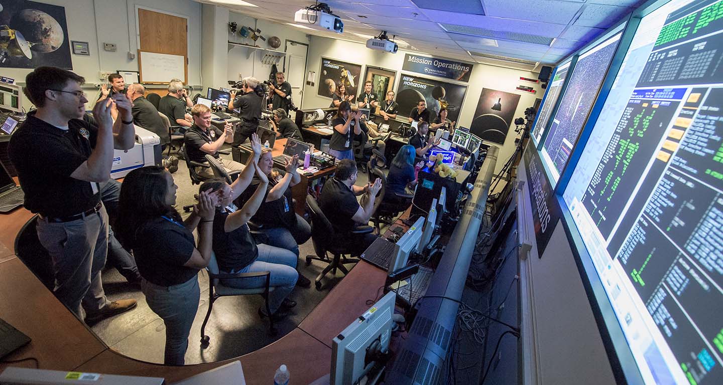 New Horizons Flight Controllers celebrate after spacecraft confirms flyby of Pluto