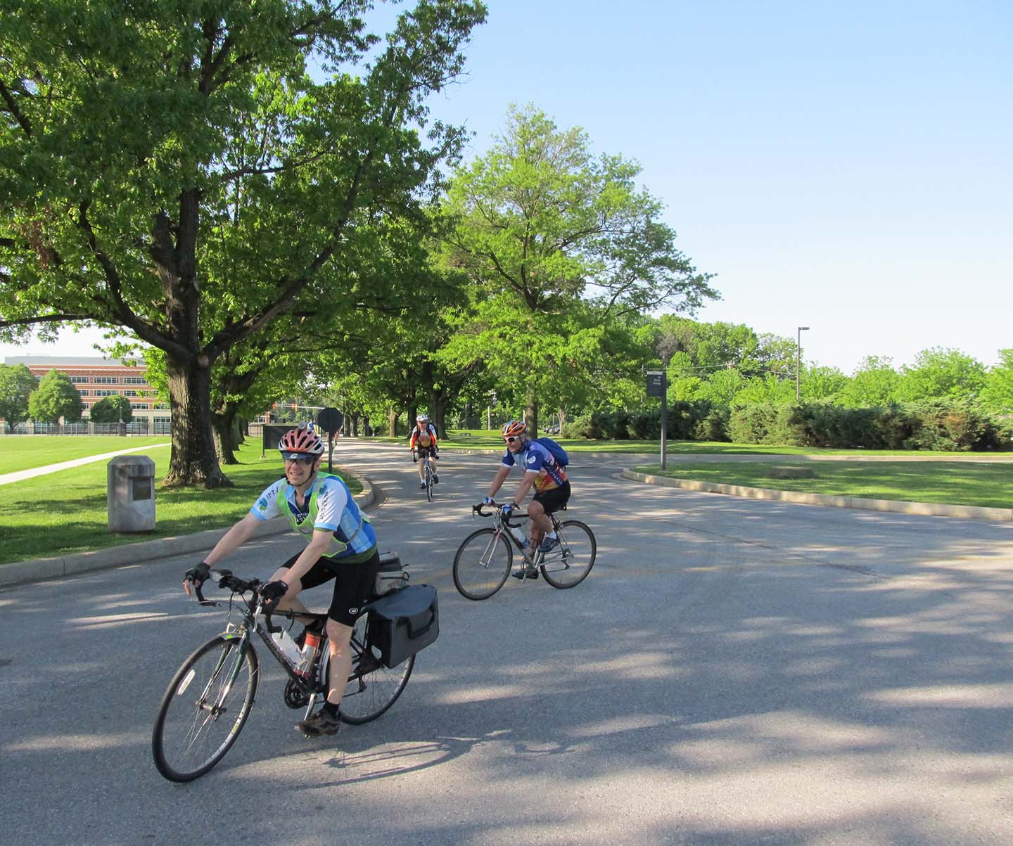 Members of APL's Cycling Club ride their bikes