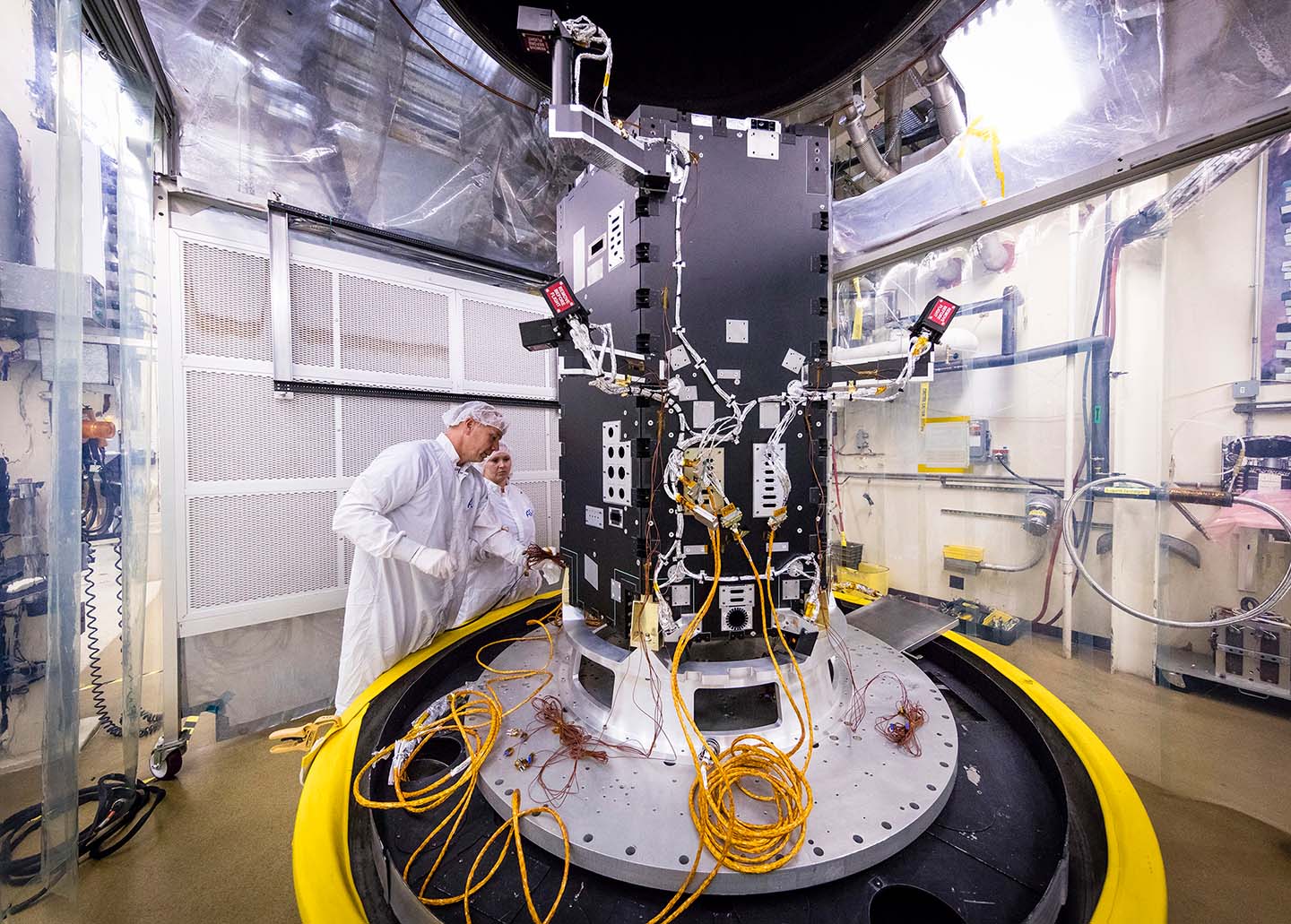 Engineers at the Johns Hopkins University Applied Physics Laboratory in Laurel, Maryland, prepare the developing Solar Probe Plus spacecraft for thermal vacuum tests that simulate conditions in space