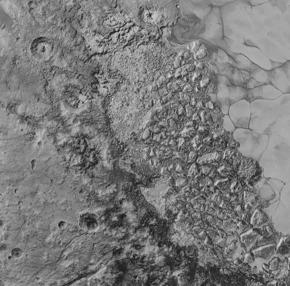 Pluto's icy mountain ridges and cratered plains