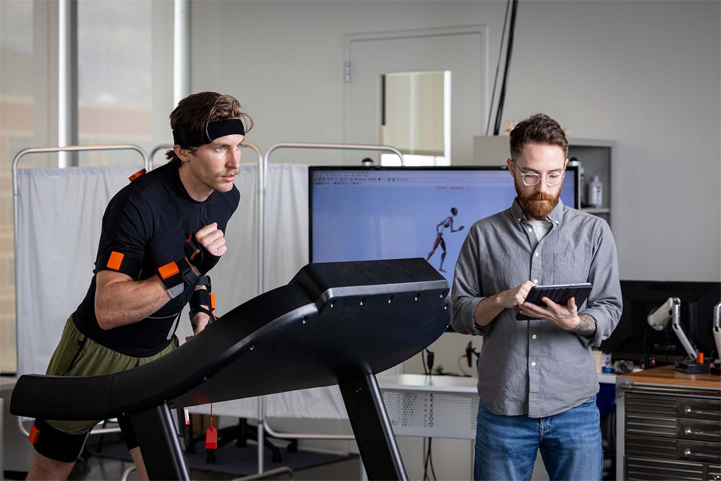 Bryndan Lindsey (right) records qualitative data during pilot tests of the sensor suite