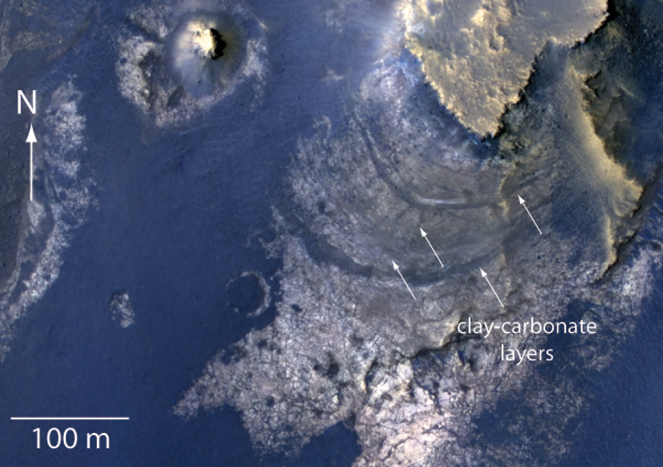 This view of layered rocks on the floor of McLaughlin Crater shows sedimentary rocks that contain spectroscopic evidence for minerals formed through interaction with water.