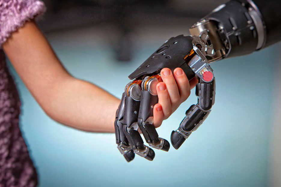 Child holds prosthetic limb