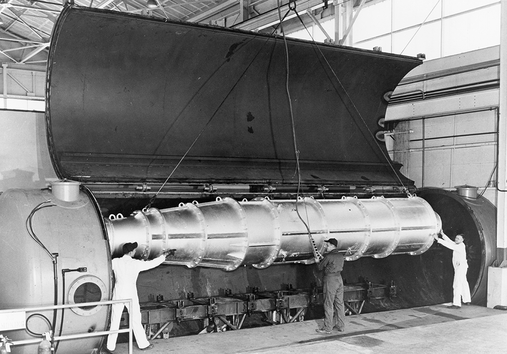 Researchers lower a large-scale ramjet engine into the high-altitude test chamber at the APL-designed and -developed Ordnance Aerophysics Laboratory 