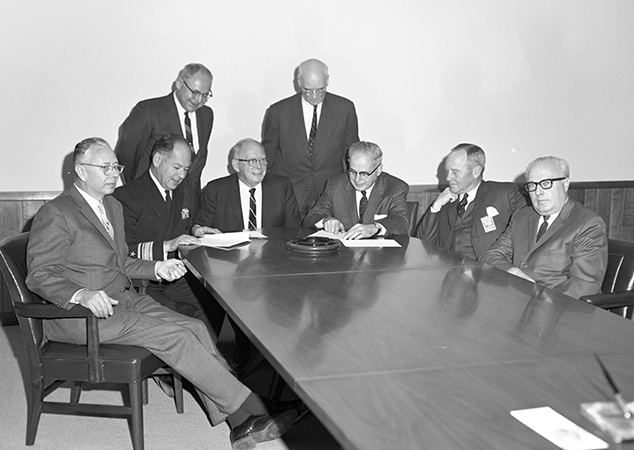 Stuart Janney Jr. (second from right) in a 1969 photo, seated with APL and Johns Hopkins University leaders.
