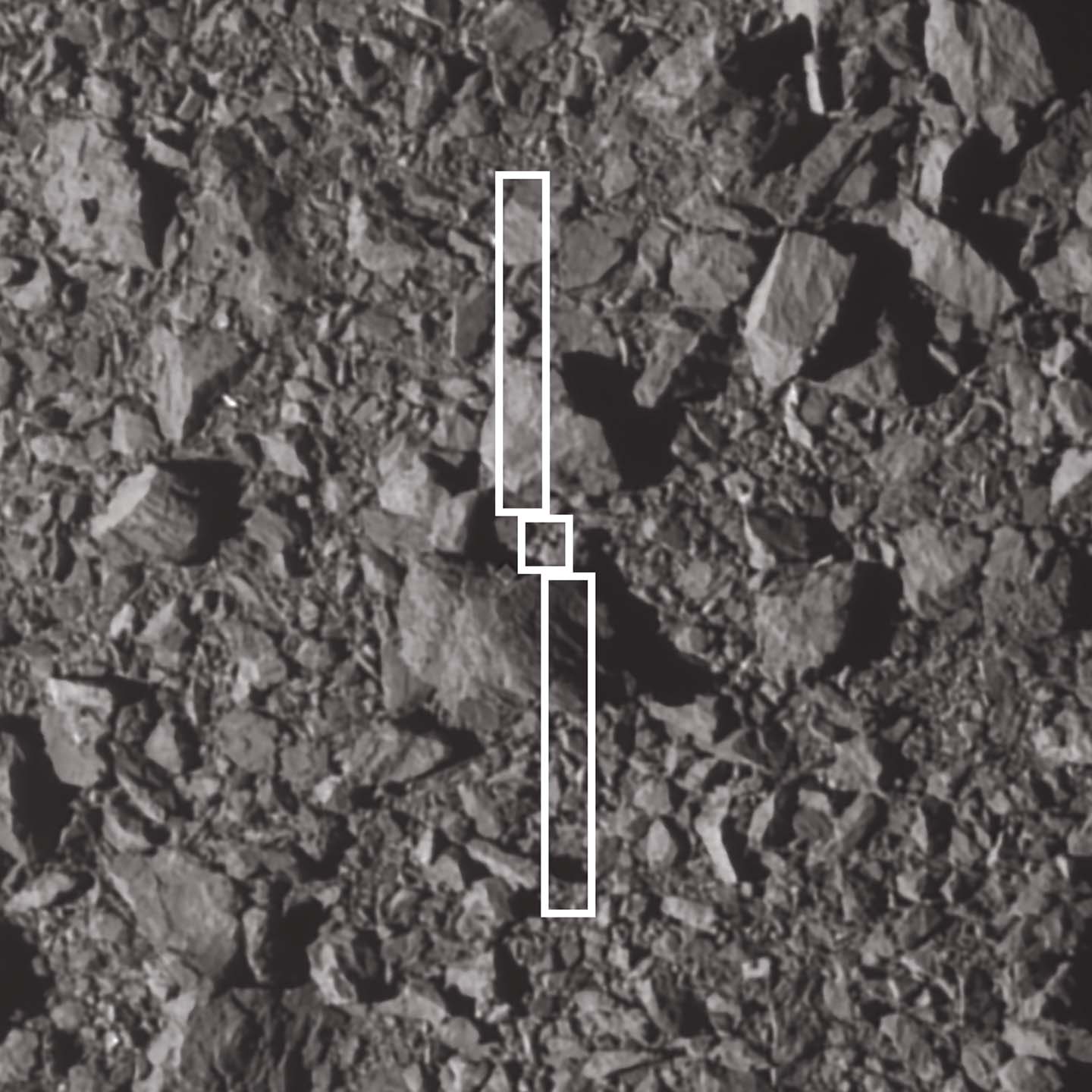 This image depicts the footprint of the Double Asteroid Redirection Test (DART) spacecraft and its two long solar panels over the spot where it impacted asteroid Dimorphos