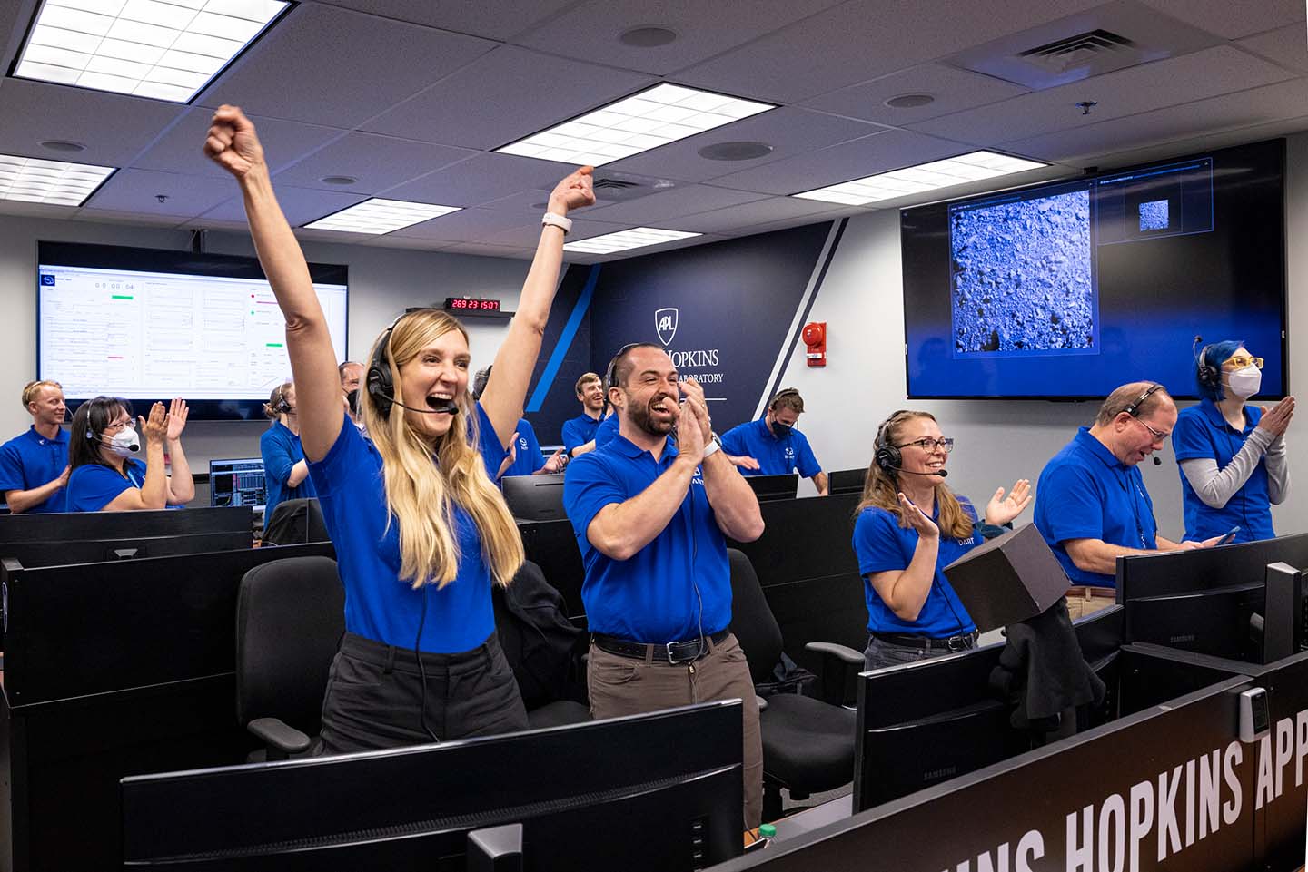 Members of the DART team celebrate on Sept. 26, 2022, as images live-streamed from the spacecraft show it successfully impacted the asteroid Dimorphos.