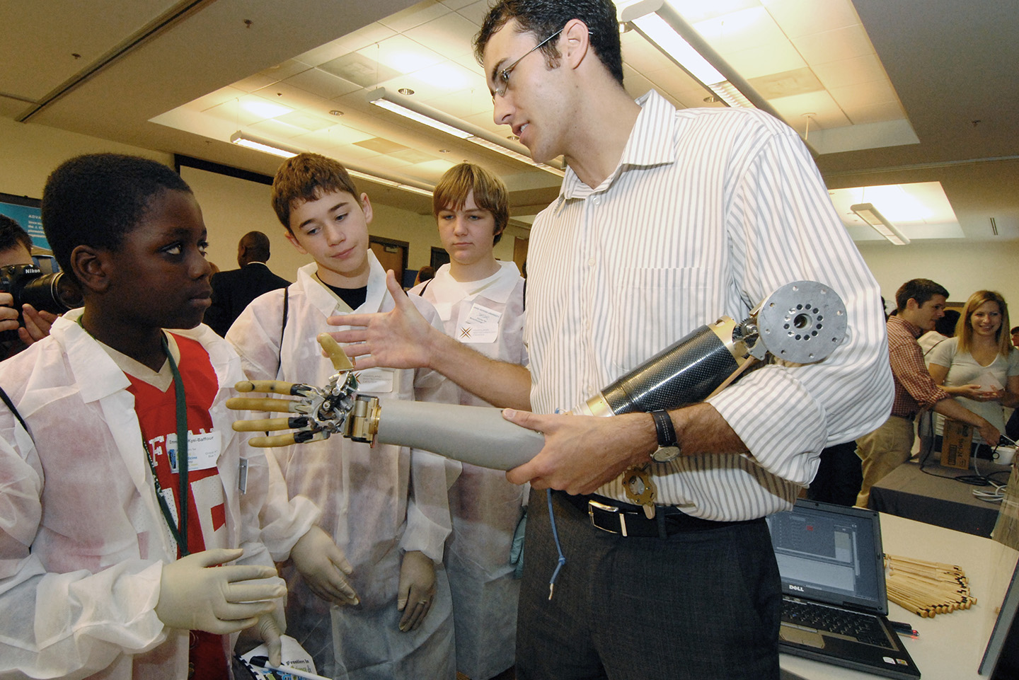 Bobby Armiger (right), Todd Levy, and Courtney Moran (not pictured) participate in the Frontiers in Science and Medicine event at the Johns Hopkins University Shady Grove Life Sciences Center