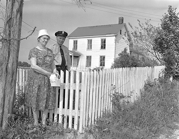 John and Winifred Parlette Dietrich pose in front of the Moore House