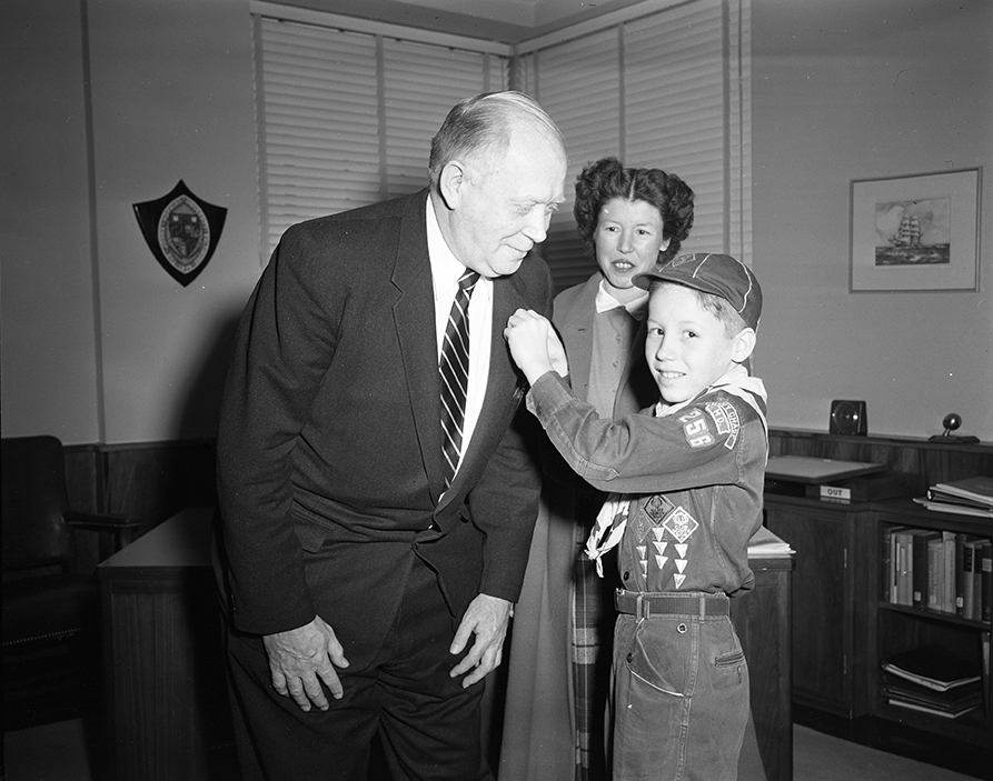 Ralph Gibson receives a Boy Scout lapel pin from William R. Blackwood Jr., of Pack 256 in Chevy Chase