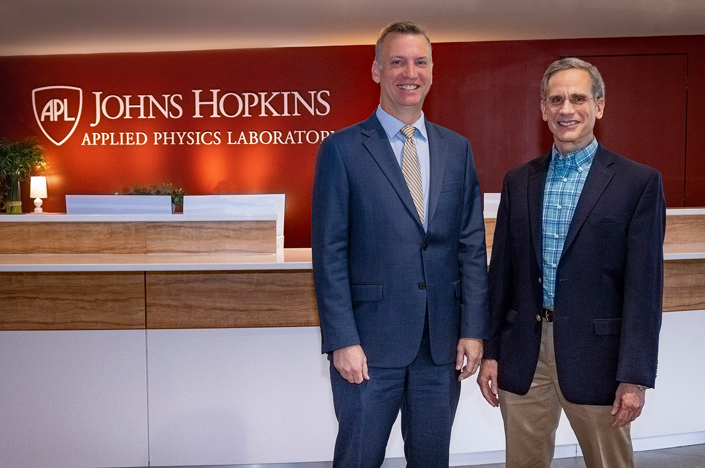 Undersecretary of the Navy Erik Raven and Johns Hopkins APL Director Ralph Semmel