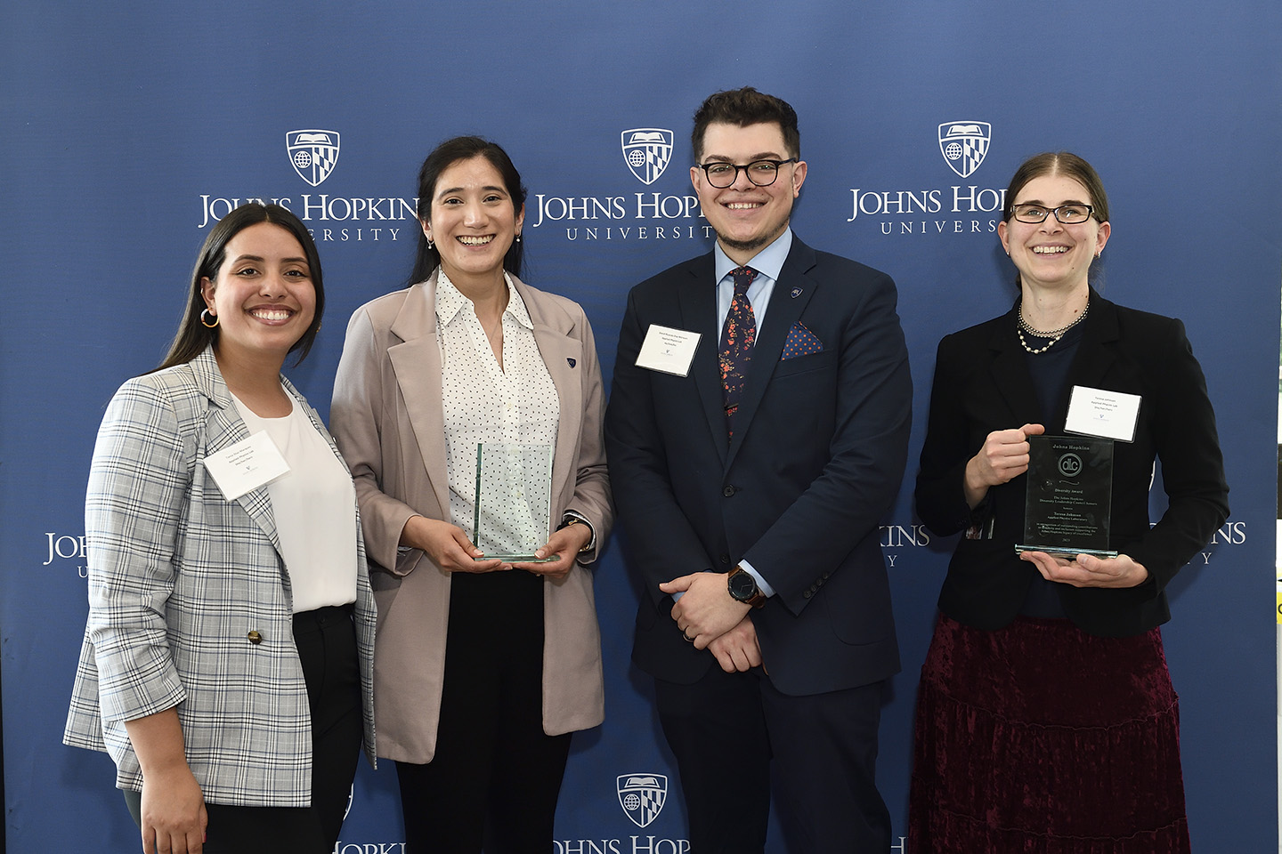 From left, Tania Dí​az Má​rquez, Mayra Amezcua, David Dí​az Má​rquez​ and Teresa Johnson, who recently were honored as recipients of the Johns Hopkins Diversity Leadership Council Diversity Recognition Awards.