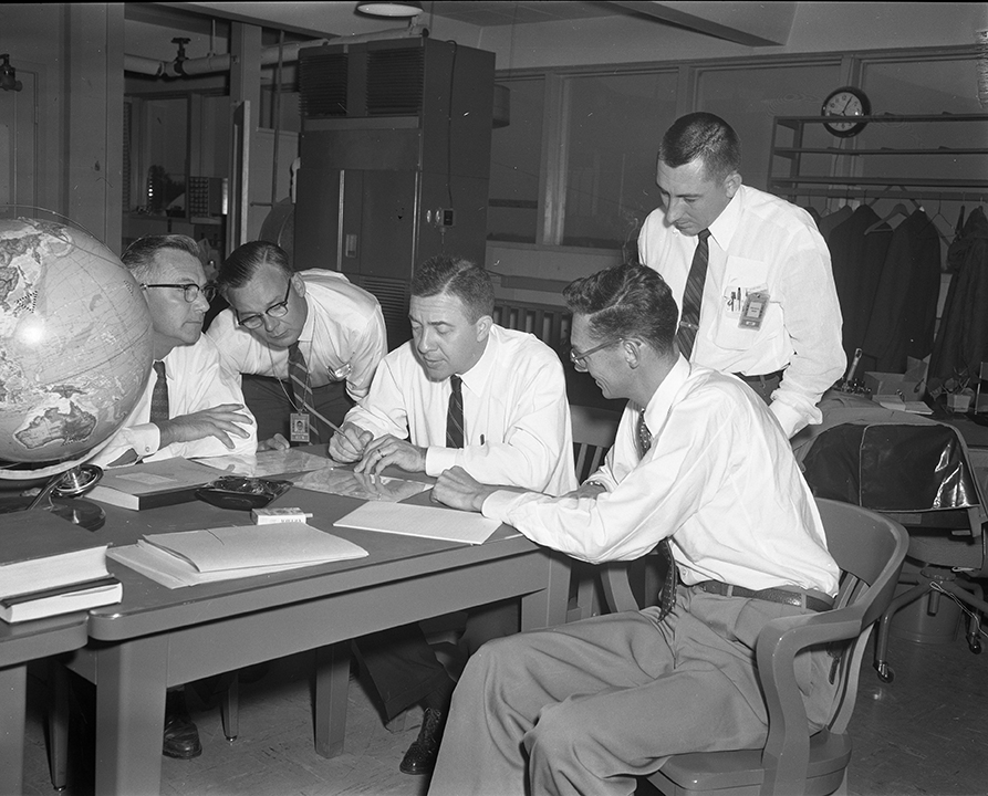 James Van Allen (center) shown during a return visit to APL in the 1950s