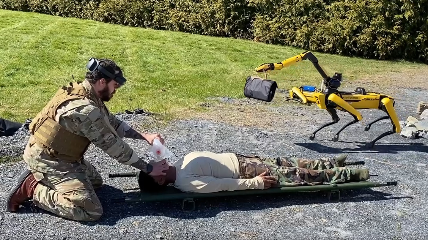 Combat medics treat a notional casualty during a demonstration of lifesaving care