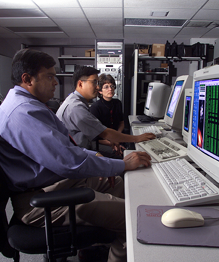Raj Patel (left), Sung Lim, and Kim Perkoski in APL’s SATRACK facility in 2002